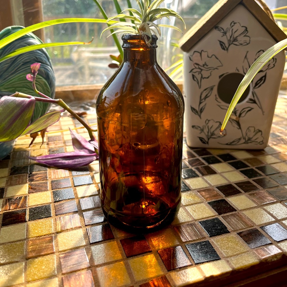 Four 10 oz amber bottle